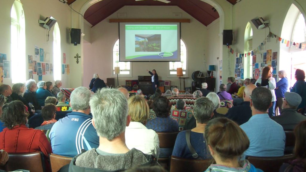 | EcoMaster Lyn presenting in front of attendees during the Sustainable House Day
