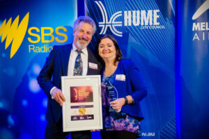 Maurice and Lyn Beinat in blue matching the Hume City Council backdrop. Sustainability Award Winners 2016 - Award Winners with Retrofit Solutions