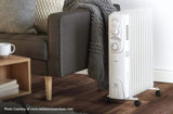 electric heater beside a sofa chair