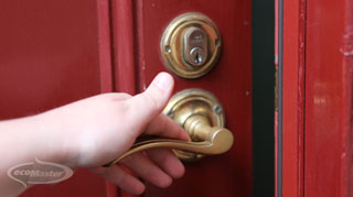 hand of man holding the knob to open the door