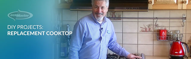 ecoMaster Maurice Beinat placing his hand on their induction cooktop