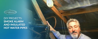 ecoMaster Maurice Beinat showing their smoke alarm and insulated hot water pipes in their ceiling